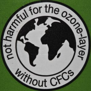 Sticker that reads: "not harmful for the ozone-layer without CFCs" with an image of the globe in the center.