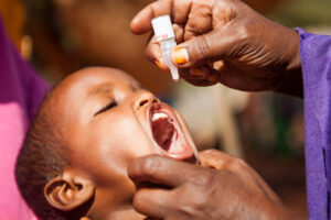 A child in Ethiopia being given an oral polio vaccine.