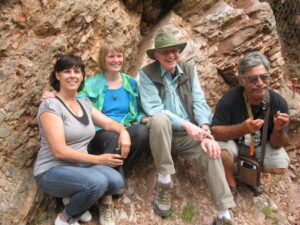 Walter Alvarez with his wife Milly Alvarez and then graduate student Alessandro Montanari (right) and his wife Paula Metallo (left) at the original site where Walter Alvarez discovered the evidence for the impact hypothesis. The site is at the K/Pg (KT) boundary in the Bottaccione Gorge near Gubbio Italy.