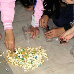 Image of children sorting through bean and tree nuts.