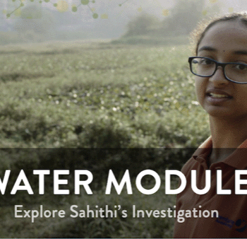 Image of a young Indian woman with glasses in a field.