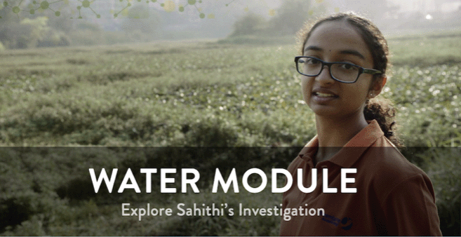 Image of a young Indian woman with glasses in a field.